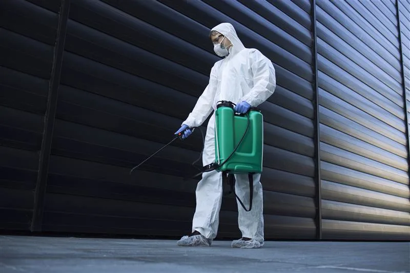person-white-chemical-protection-suit-doing-disinfection-public-areas-stop-spreading-highly-contagious-corona-virus